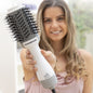 Woman holding InnovaGoods white-grey ionic hair dryer and volumising brush